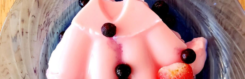 Strawberry Blancmange on a glass plate, topped with fruit